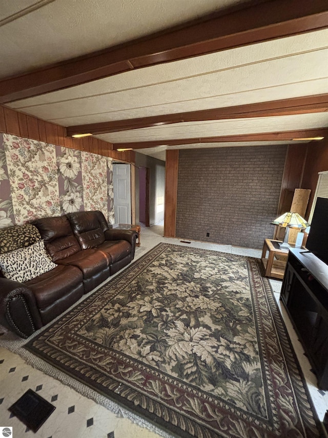 living area with beamed ceiling