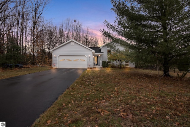 view of front facade featuring driveway and an attached garage