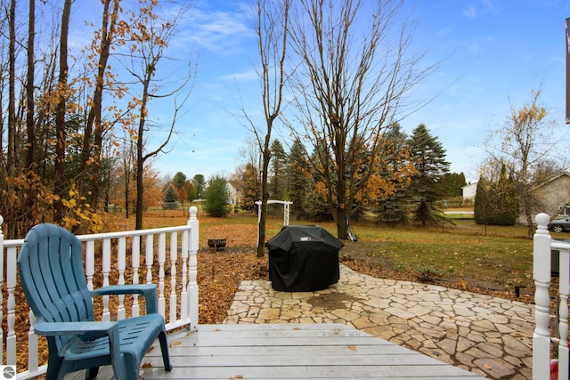 deck with grilling area and a patio
