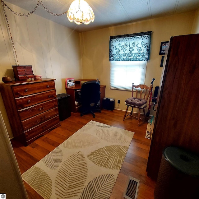 4548 Goldenrod Dr, Traverse City, MI 49686 - office space with a chandelier and wood finished floors