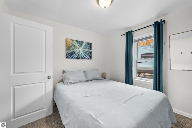 carpeted bedroom with baseboards