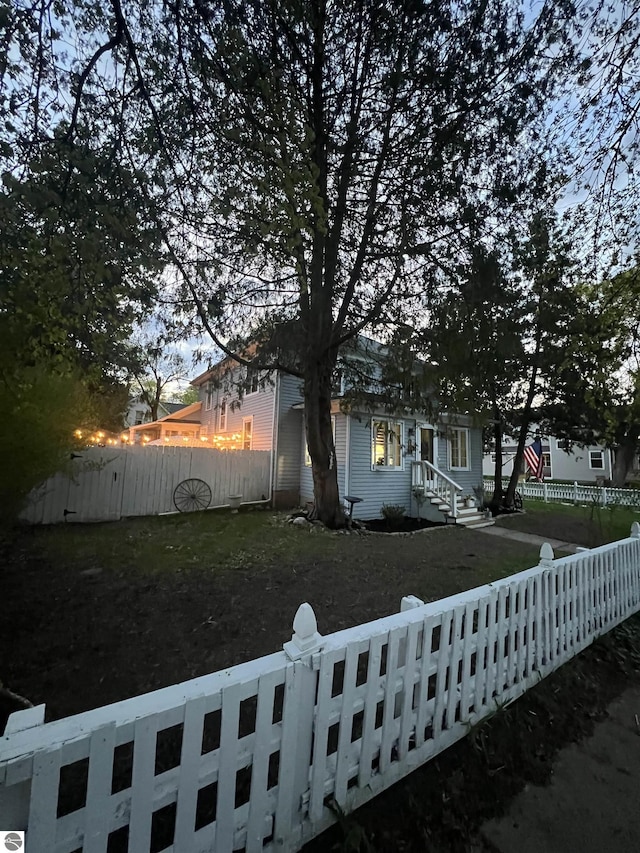 view of side of property featuring a fenced front yard