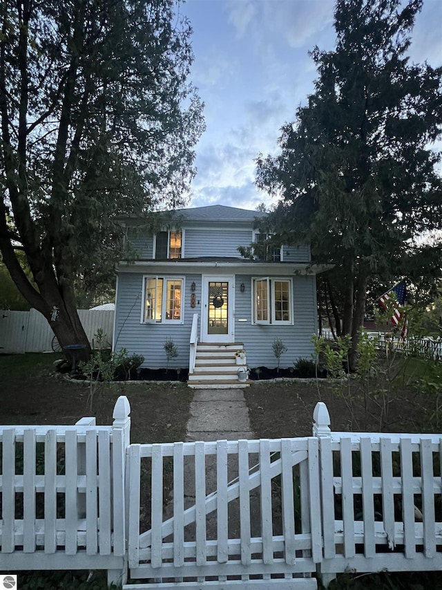 bungalow with a fenced front yard