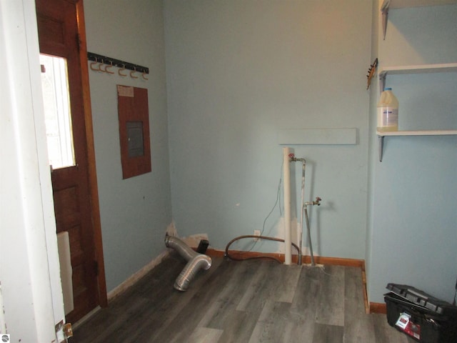 washroom featuring laundry area and wood finished floors