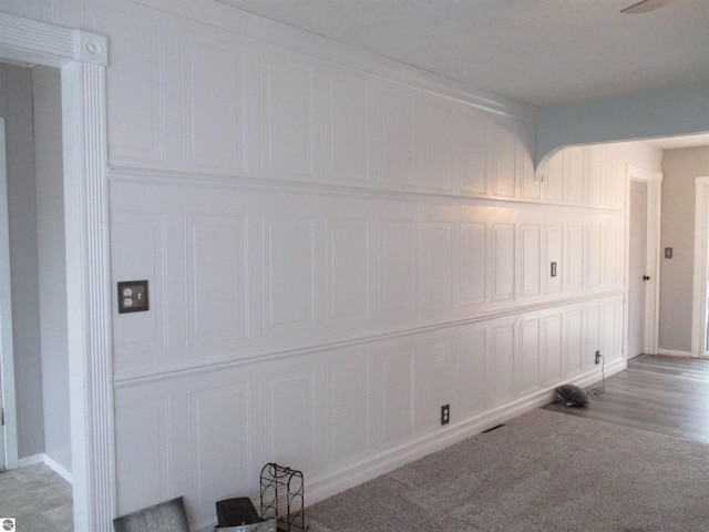 spare room with light colored carpet and baseboards