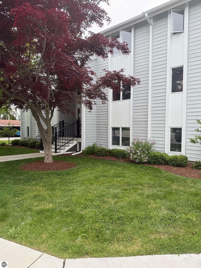 750 Centre Pl Unit 2, Traverse City, MI 49686 - view of front of home featuring a front yard