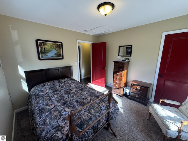 bedroom with baseboards and dark colored carpet