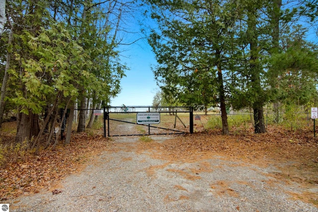 view of gate featuring fence