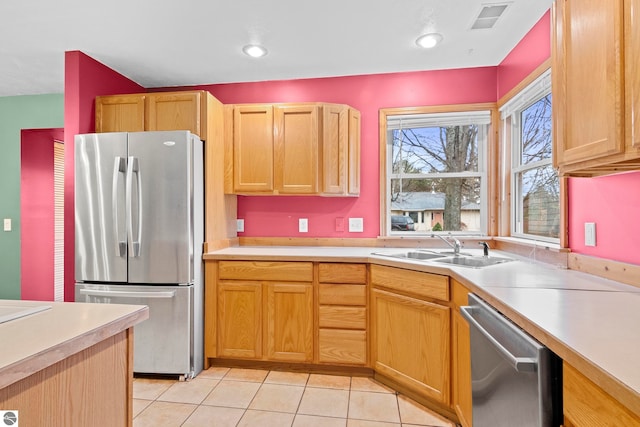 kitchen featuring a sink, visible vents, light countertops, and appliances with stainless steel finishes