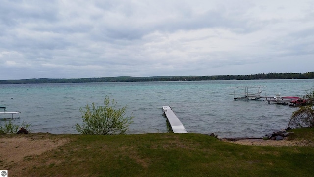 12110 Jonathan Dr, Rapid City, MI 49676 - dock featuring a water view