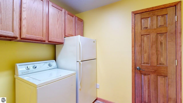 12110 Jonathan Dr, Rapid City, MI 49676 - laundry room with washer / clothes dryer and cabinet space