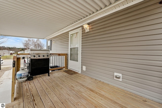 wooden terrace with area for grilling