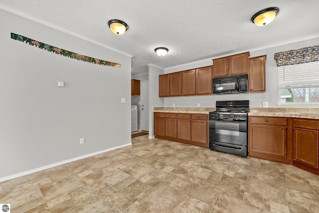 kitchen with brown cabinets, light countertops, black appliances, and crown molding