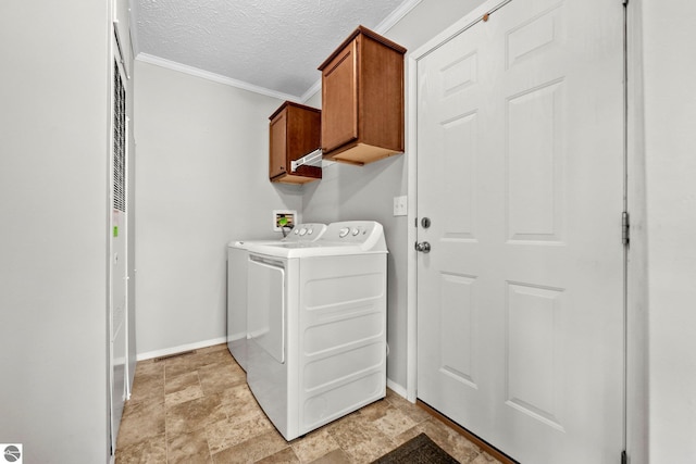 washroom featuring cabinet space, ornamental molding, baseboards, and a textured ceiling