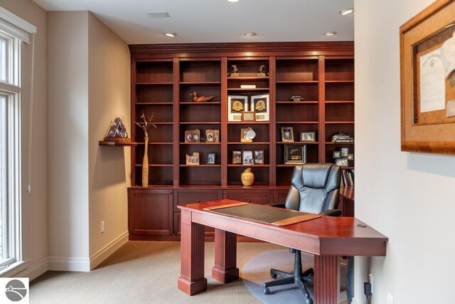 6579 Woods Creek Dr, Charlevoix, MI 49720 - office area with light colored carpet and baseboards