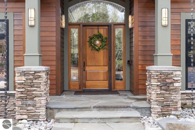 6579 Woods Creek Dr, Charlevoix, MI 49720 - property entrance featuring a porch