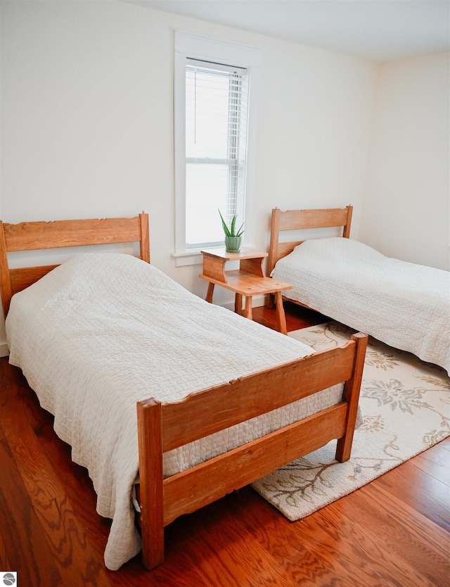 bedroom with wood finished floors