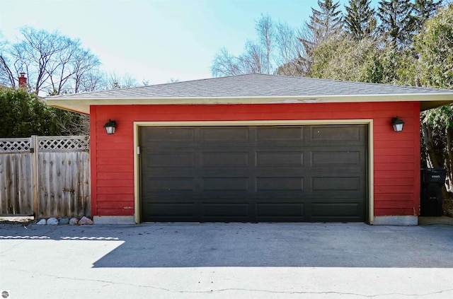 detached garage with fence