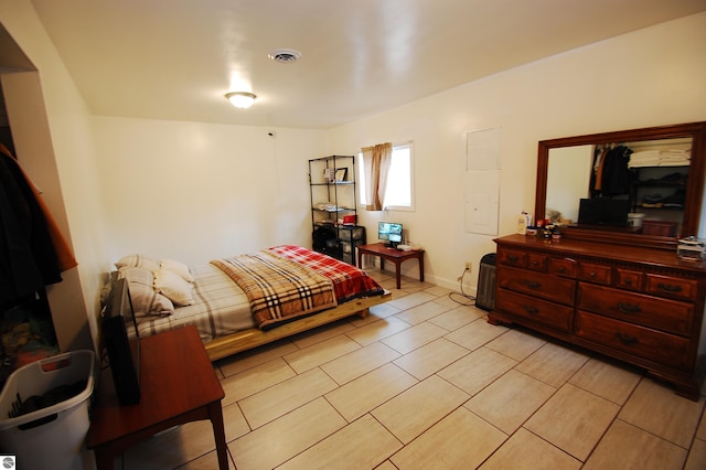 bedroom featuring visible vents and baseboards
