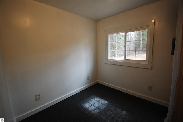 spare room featuring baseboards