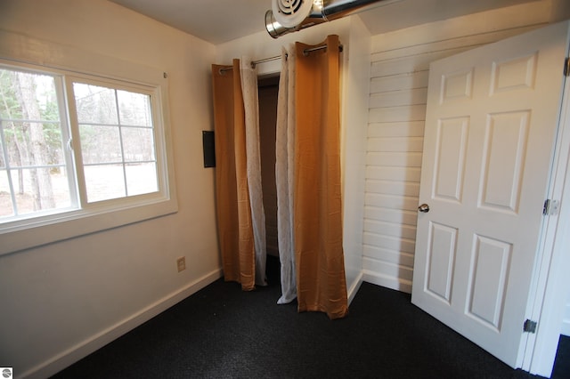 unfurnished bedroom with baseboards