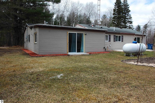 rear view of house with a lawn