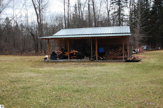 view of pole building with a yard
