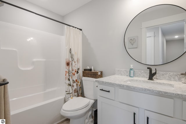 full bathroom with shower / tub combo with curtain, vanity, and toilet