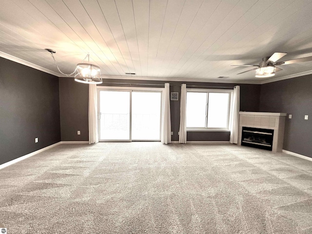 624 S Lake St, Cadillac, MI 49601 - unfurnished living room with baseboards, a fireplace, crown molding, a ceiling fan, and carpet floors