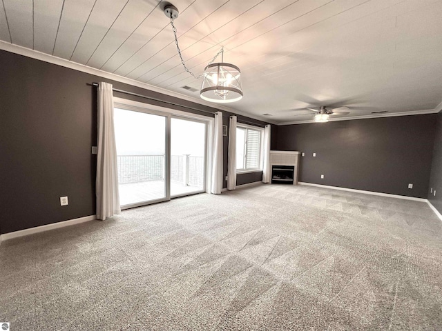 624 S Lake St, Cadillac, MI 49601 - unfurnished living room with crown molding, baseboards, a ceiling fan, and carpet