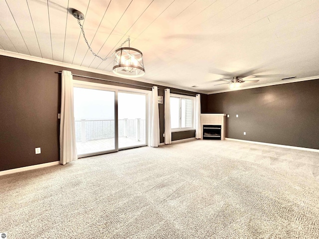 624 S Lake St, Cadillac, MI 49601 - unfurnished living room with carpet flooring, ceiling fan, baseboards, and ornamental molding