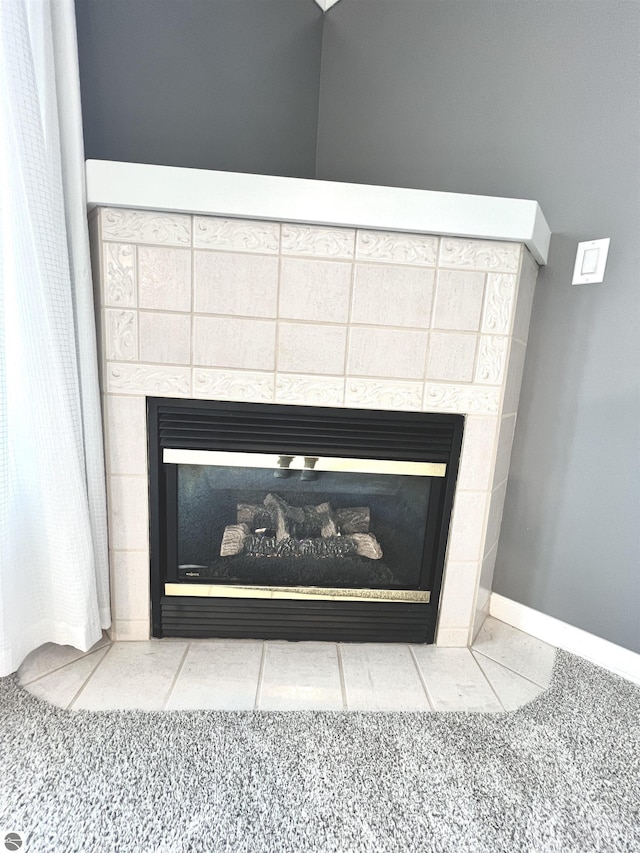 624 S Lake St, Cadillac, MI 49601 - room details featuring baseboards and a fireplace