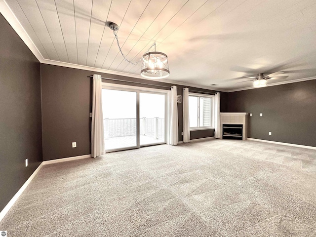 624 S Lake St, Cadillac, MI 49601 - unfurnished living room with baseboards, a ceiling fan, a fireplace, crown molding, and carpet floors