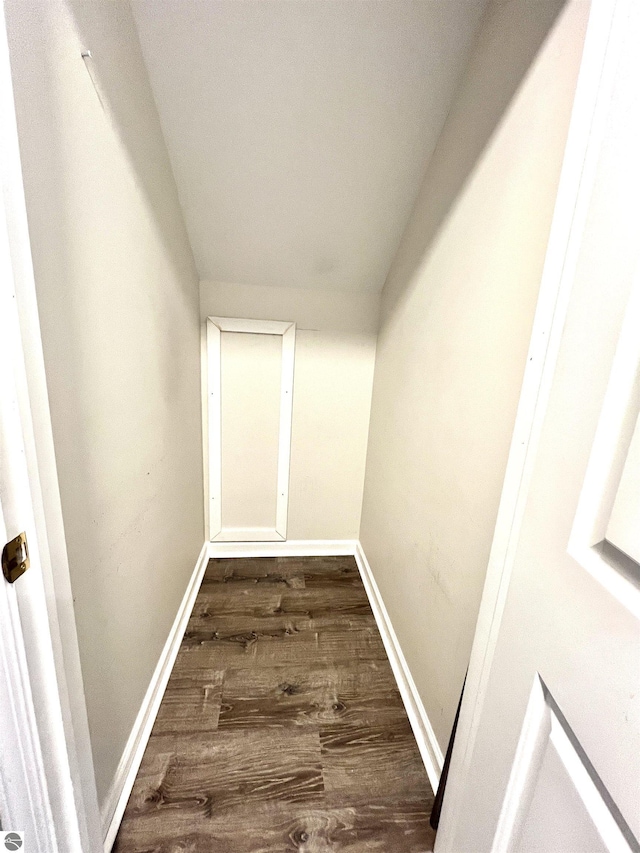 624 S Lake St, Cadillac, MI 49601 - hall with dark wood-style flooring and baseboards