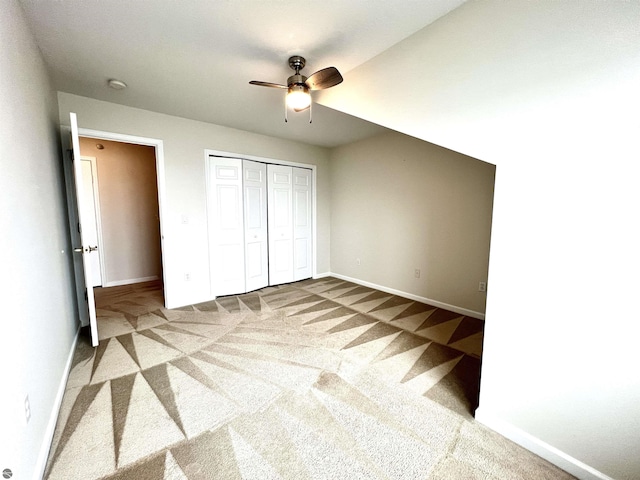 624 S Lake St, Cadillac, MI 49601 - unfurnished bedroom featuring a closet, baseboards, carpet flooring, and ceiling fan