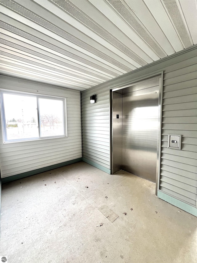 624 S Lake St, Cadillac, MI 49601 - unfurnished sunroom featuring elevator