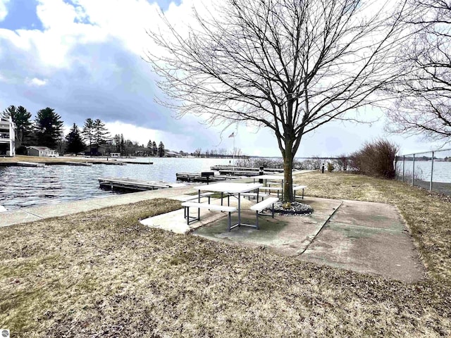 624 S Lake St, Cadillac, MI 49601 - view of yard featuring a water view and a boat dock
