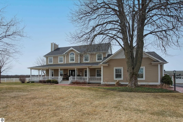 view of front of property featuring fence, a chimney, a front lawn, and covered porch