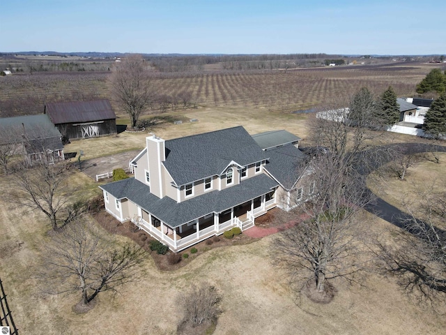 birds eye view of property featuring a rural view