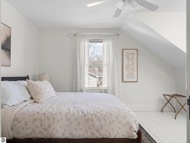 215 N Saint Marys St, Suttons Bay, MI 49682 - bedroom featuring wood finished floors, a ceiling fan, and lofted ceiling