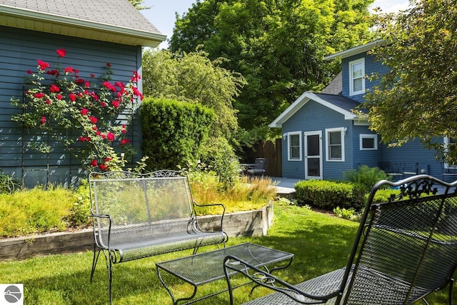 215 N Saint Marys St, Suttons Bay, MI 49682 - view of yard with a trampoline and outdoor dining area