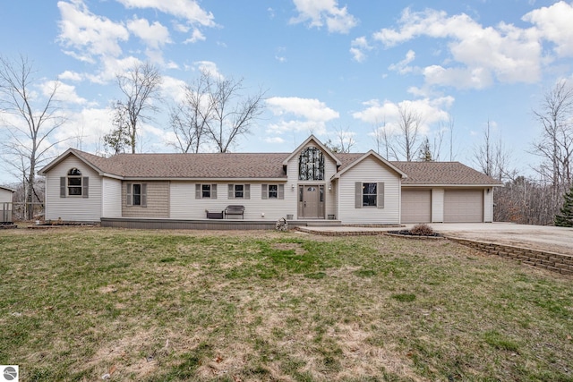 single story home with a garage, concrete driveway, and a front lawn