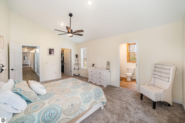 bedroom with a closet, ensuite bath, and baseboards