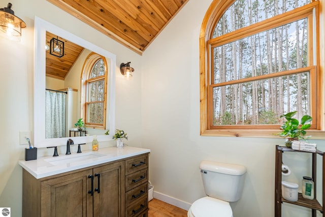bathroom featuring baseboards, toilet, wood ceiling, wood finished floors, and lofted ceiling