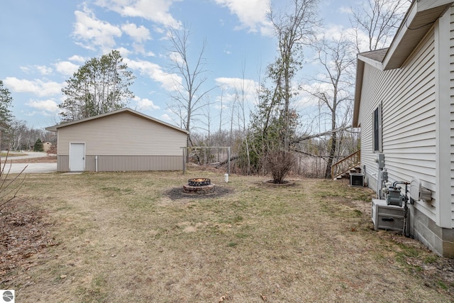 view of yard with an outdoor fire pit