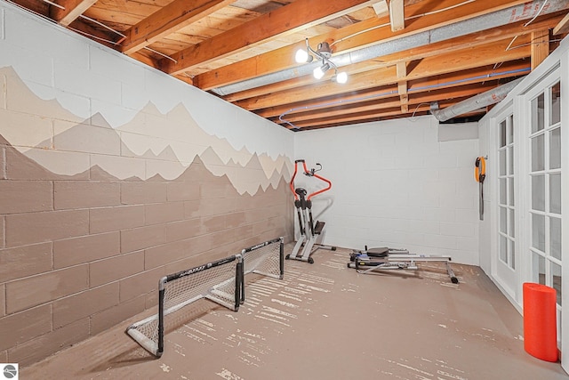 interior space with concrete block wall
