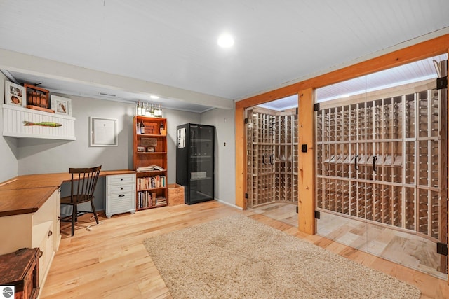 wine area featuring recessed lighting and wood finished floors