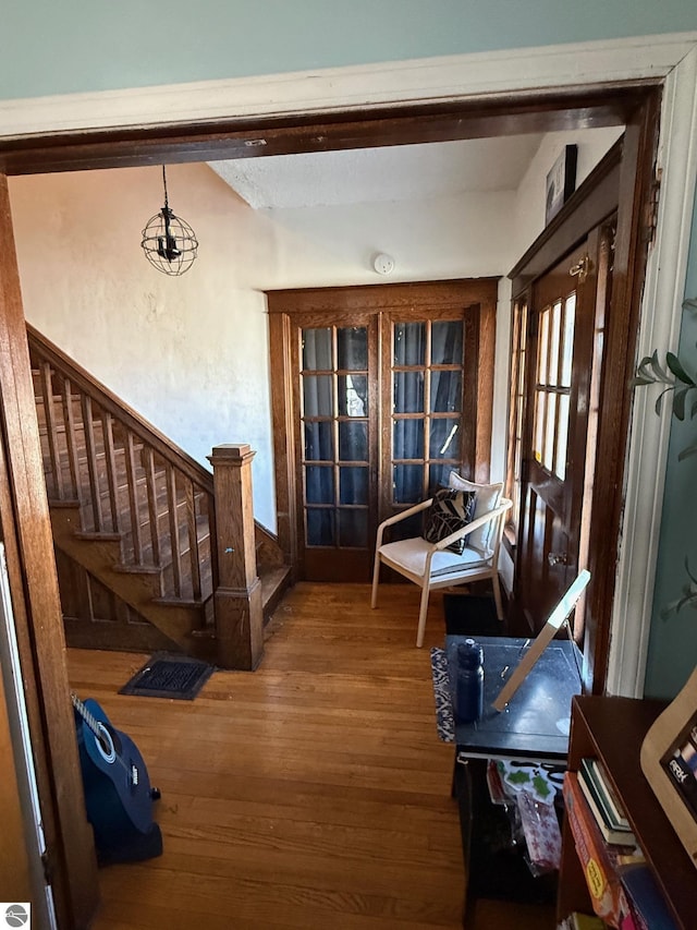 303 W Washington Ave, Saint Louis, MI 48880 - interior space with stairs, french doors, and wood finished floors