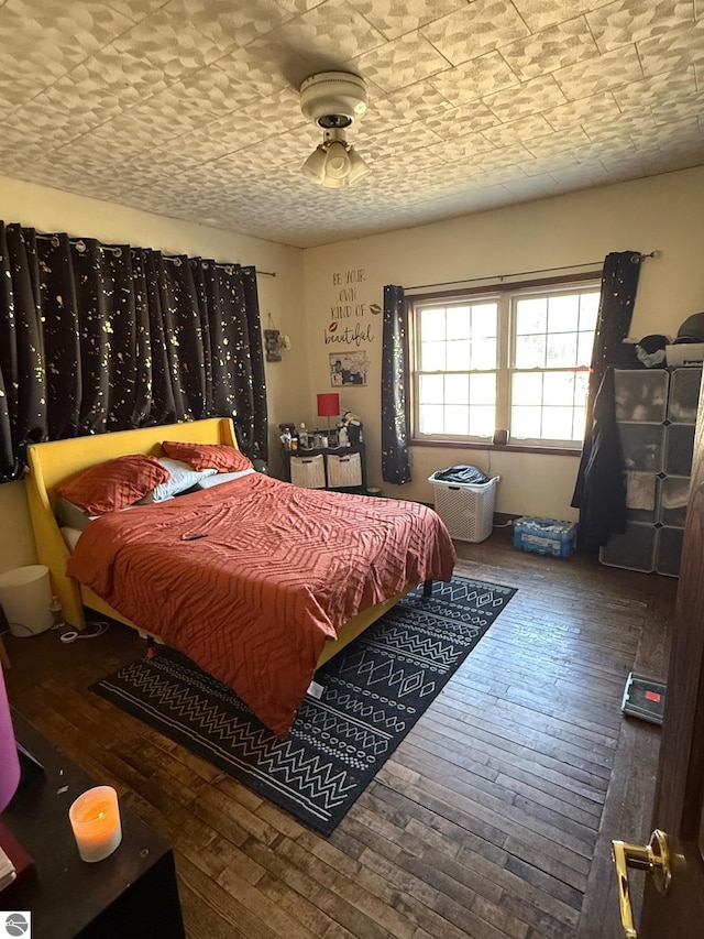 303 W Washington Ave, Saint Louis, MI 48880 - bedroom with wood-type flooring
