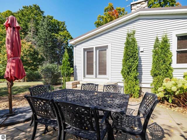 view of patio featuring outdoor dining area